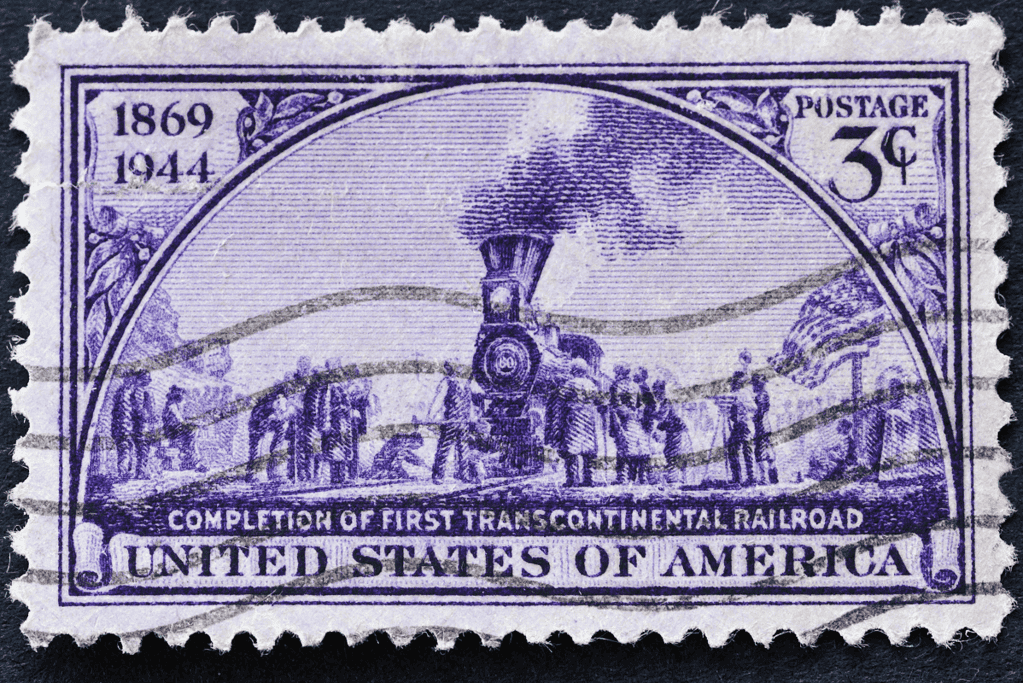 Image of a postage stamp commemorating the completion of one of the seven wonders of the industrial world, the first transcontinental railroad