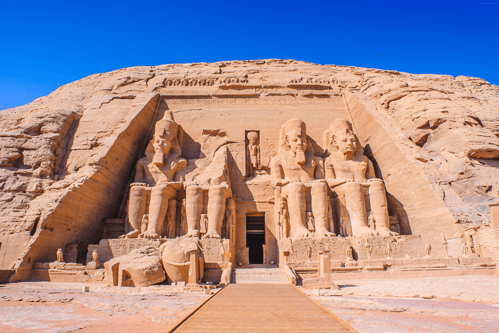 Image of the Temple of Abu Simbel with colossal statues depicting the pharaohs of ancient Egypt