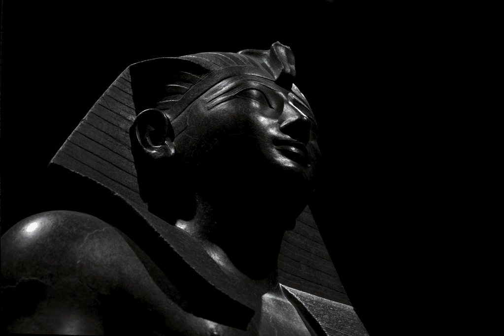 Image of a statue of Thutmose III, one of the formidable pharaohs of ancient Egypt, captured in stone.