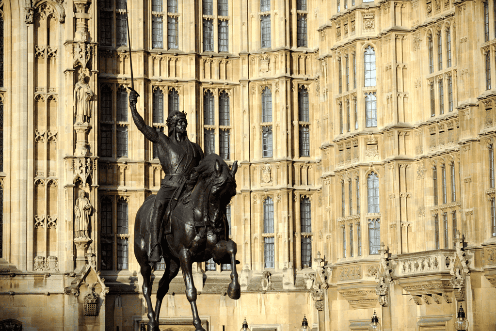 Image of a statue of William the Conqueror in front of Westminster Abbey in London