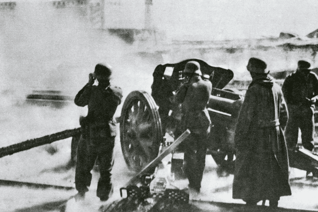 German soldiers operating artillery during World War 2, illustrating a scene typical of modern history battles