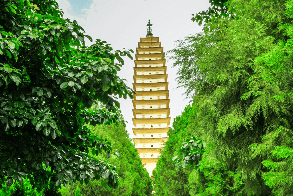 A photograph of a meticulously reconstructed Song Dynasty pagoda standing proudly in Yunnan, China.