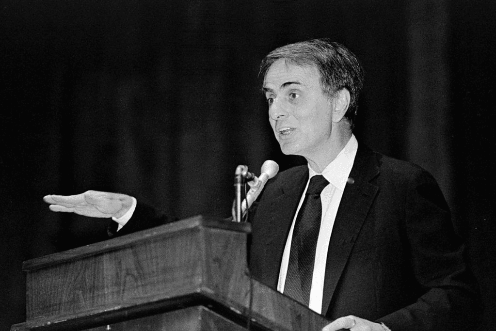 Image of Carl Sagan animatedly delivering a lecture on the wonders of the universe.