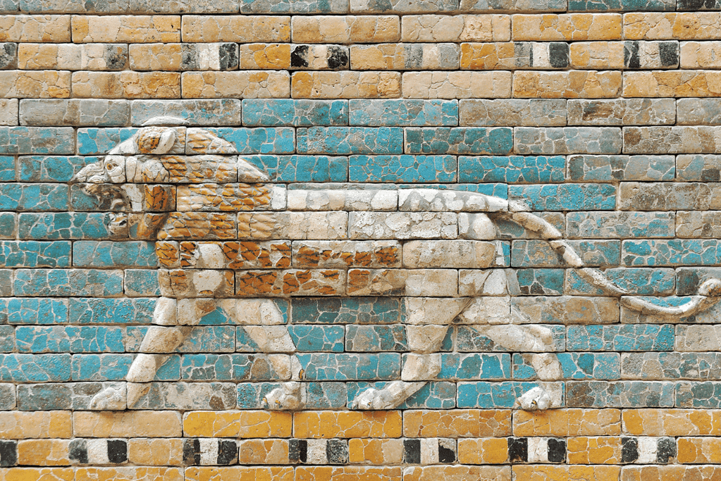 Image of a beautifully crafted wall relief of a majestic lion, part of the iconic Ishtar Gate in ancient Babylon, showcasing the artistry and grandeur of Mesopotamian architecture.
