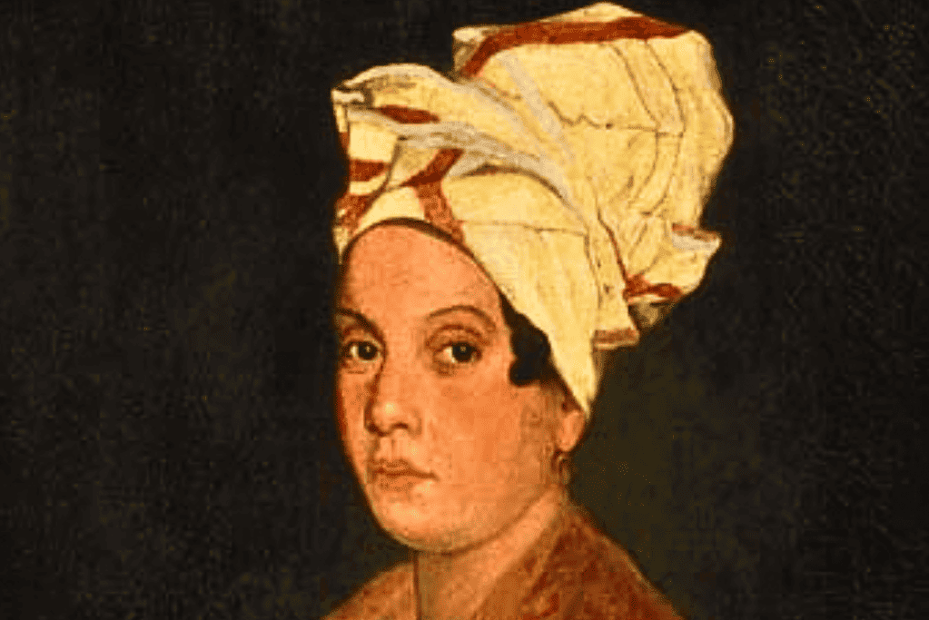 Image of a portrait of Marie Laveau, capturing her striking features and traditional Creole attire, representative of 19th-century New Orleans.