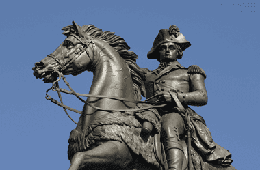 Image of a bronze statue depicting General George Washington mounted on a horse, symbolizing his pivotal role in the significant battles of the American Revolution.