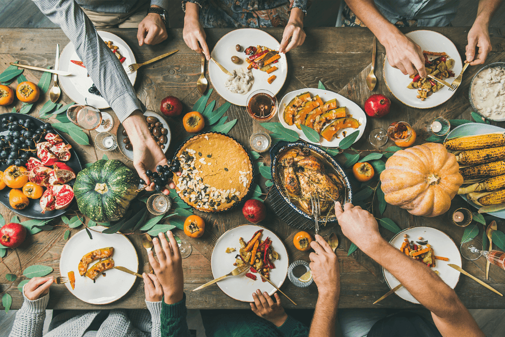 Image capturing a family enjoying a Thanksgiving dinner together, a scene of togetherness and gratitude.
