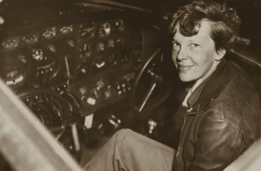 Image of legendary pilot Amelia Earhart in the cockpit for an article covering interesting facts about Amelia Earhart.