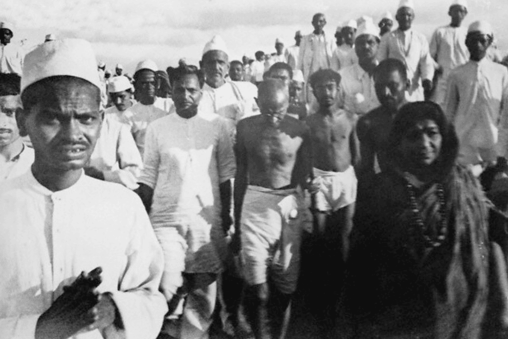 facts-about-mahatma-gandhi-salt-march Image of Gandhi with supporters on his 1930 Salt March for a blog post covering facts about Mahatma Gandhi.