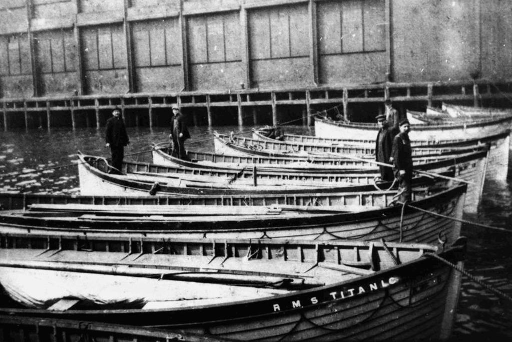 Image of a group of lifeboats gathered after the Titanic tragedy, symbolizing the resilience and collective effort of survivors.