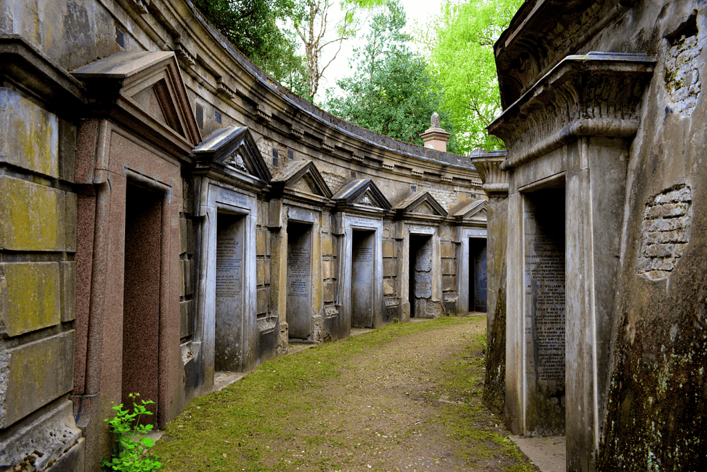 Image of a ring of mausoleums at Highgate Cemetery in London for an article about London's magnificent seven cemeteries.