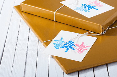 Image of giftwrapped books for a blog post recommending 10 top historical fiction books for Christmas gifts.