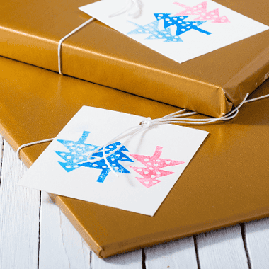 Image of giftwrapped books for a blog post recommending 10 top historical fiction books for Christmas gifts.