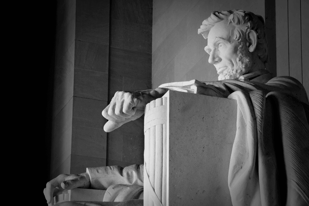Image of a statue of a seated Abraham Lincoln at the Lincoln Memorial in Washington D.C. for a blog post covering 10 interesting facts about Abraham Lincoln.