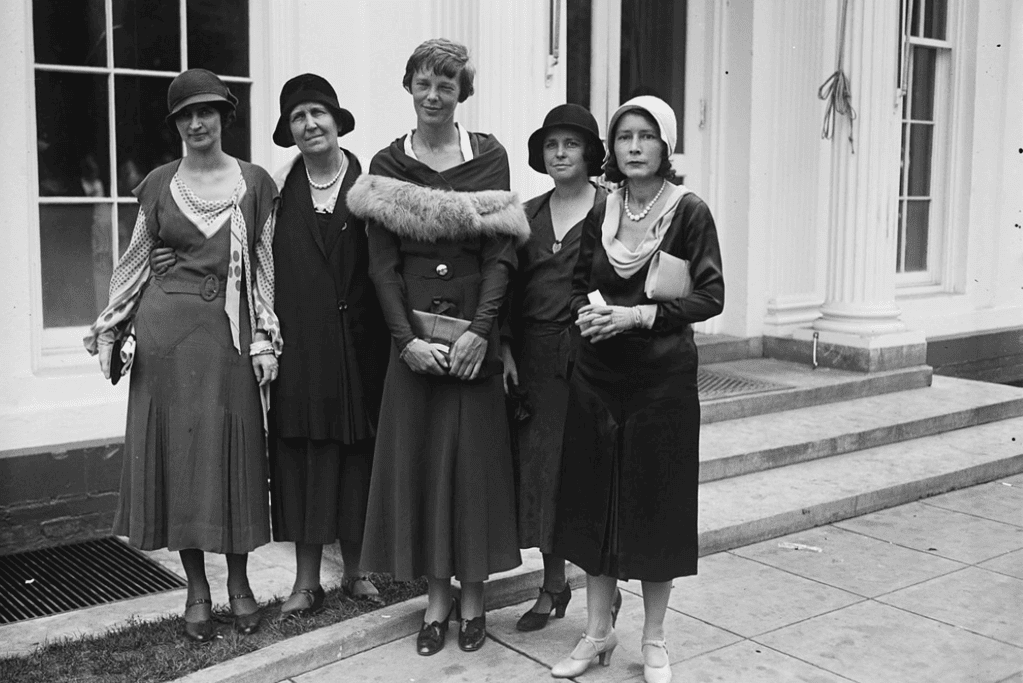 Image of Amelia Earhart pictured with several women's rights advocates.
