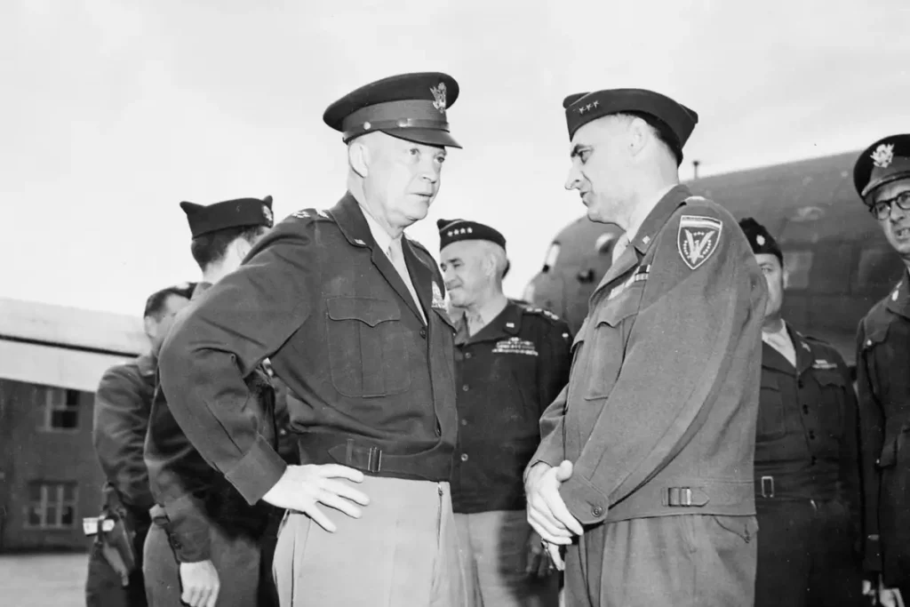 Image of General Dwight Eisenhower conferring with another general for a blog post covering interesting facts about Dwight Eisenhower.