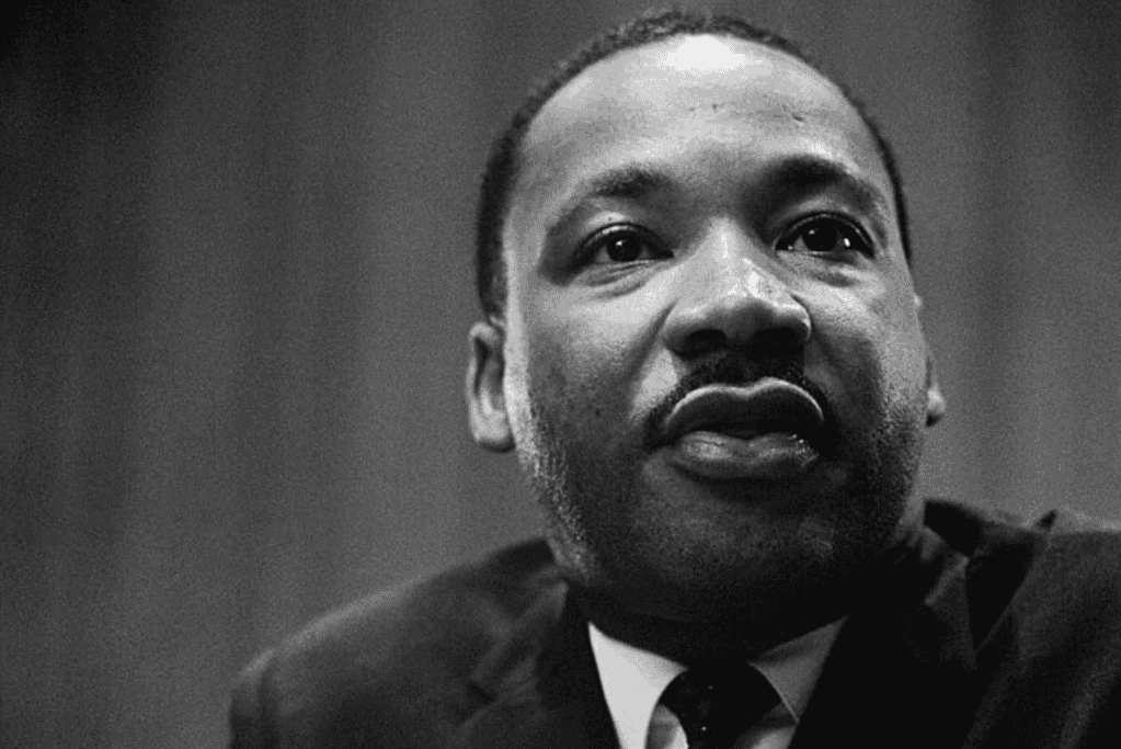 Image of MLK speaking as part of a panel.