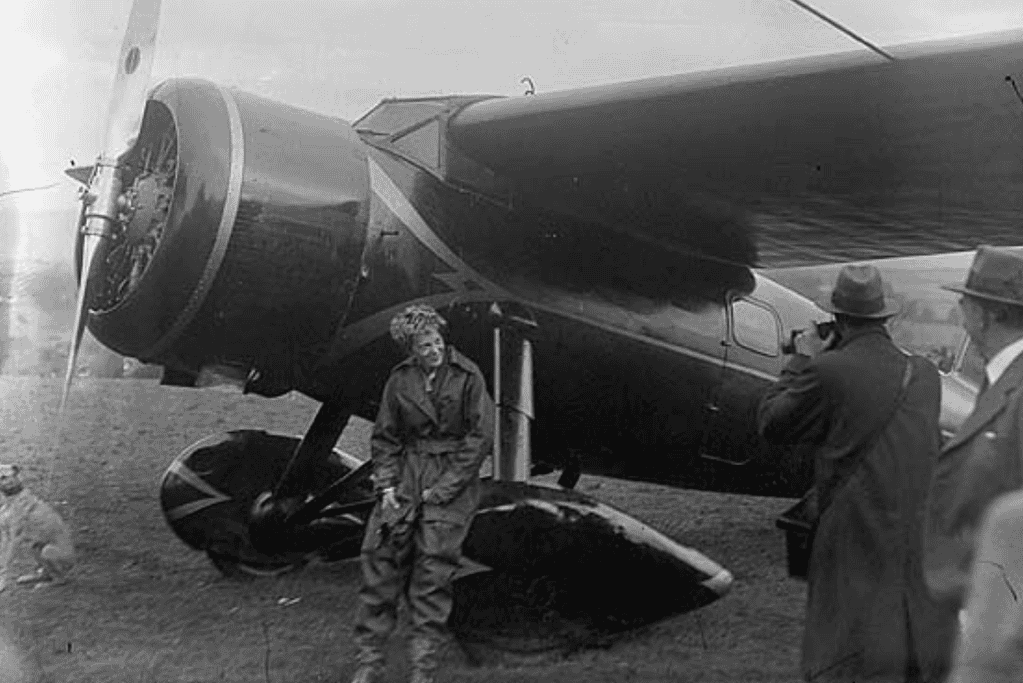 Amelia Earhart with her Lockheed Vega after a flight, the first woman to fly solo across the Atlantic Ocean