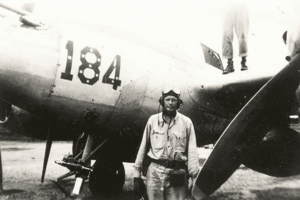 Charles Lindbergh standing in front of a P-38 Lightning, the aviation pioneer who made the first solo nonstop transatlantic flight