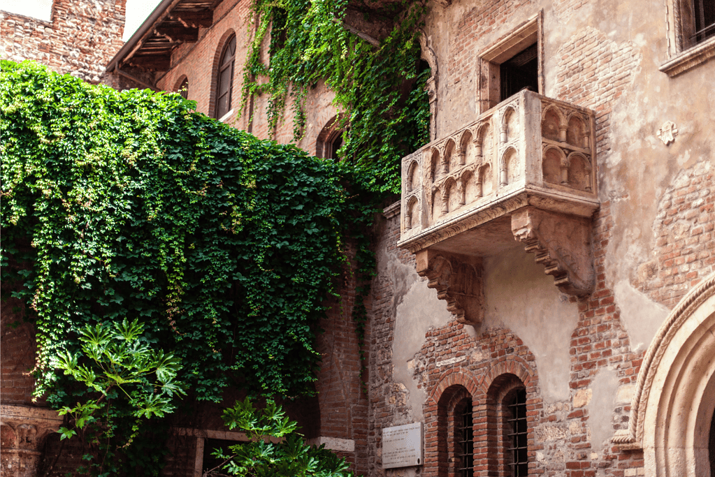 Image of the Romeo and Juliet balcony in Verona, Italy for a blog post covering interesting facts about William Shakespeare.