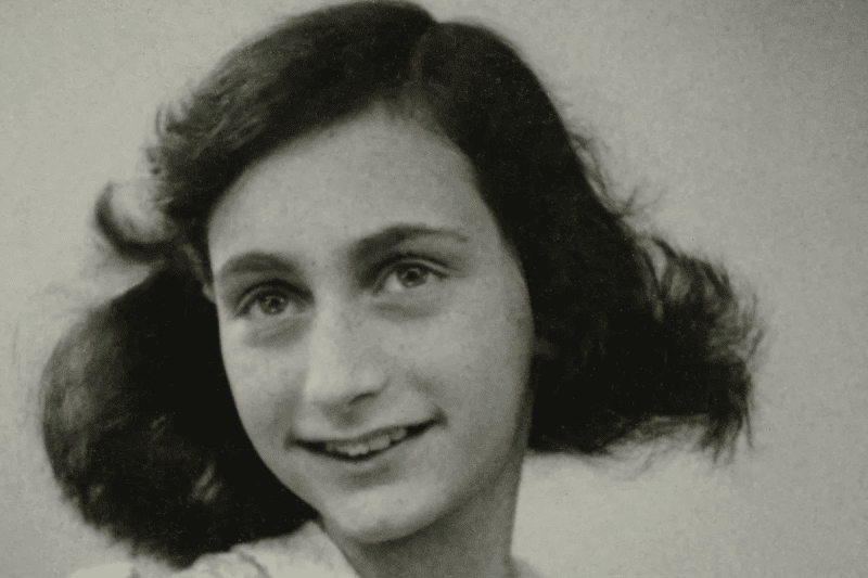 Image of a passport photo of Anne Frank for a blog post covering 10 interesting facts about Anne Frank.