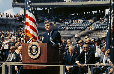 Image of JFK speaking at his inauguration in 1961 for a post providing a list of U.S. Presidents and party affiliated with.