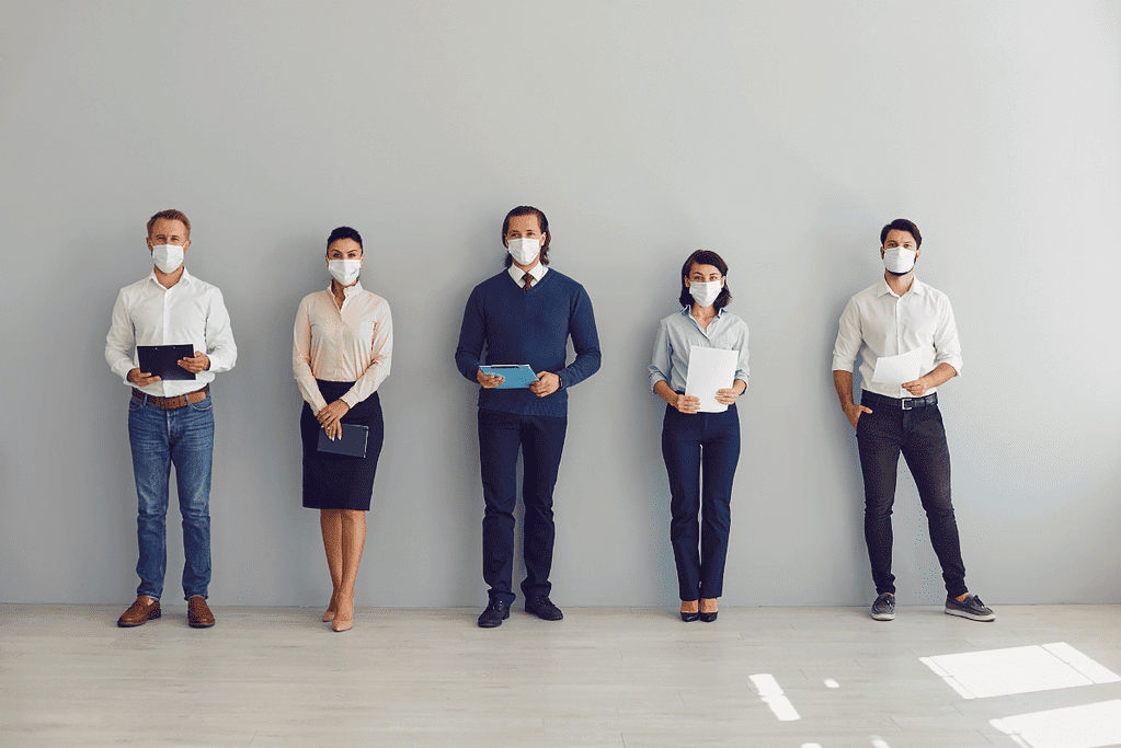 Image of people wearing masks during the COVID 10 pandemic for a blog post covering pandemics throughout history.