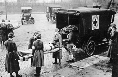 Image of nurses loading a patient into an ambulance during the Spanish Flu epidemic for a blog post covering pandemics throughout history.