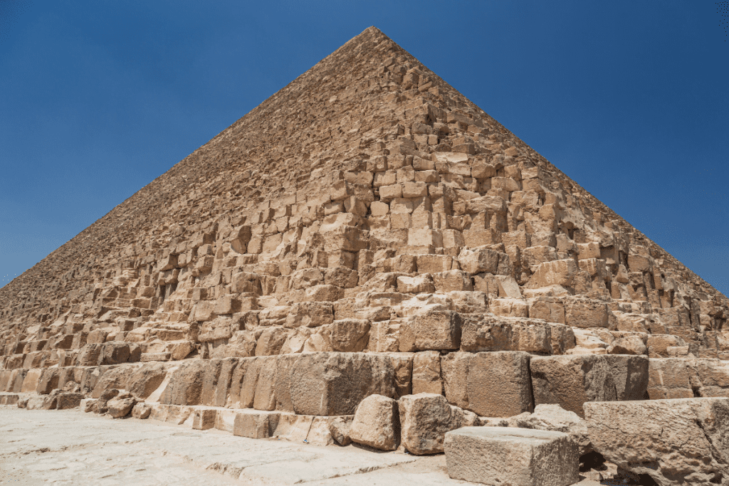 Image of the vastness of the Great Pyramid of Giza, one of the tallest buildings in history.