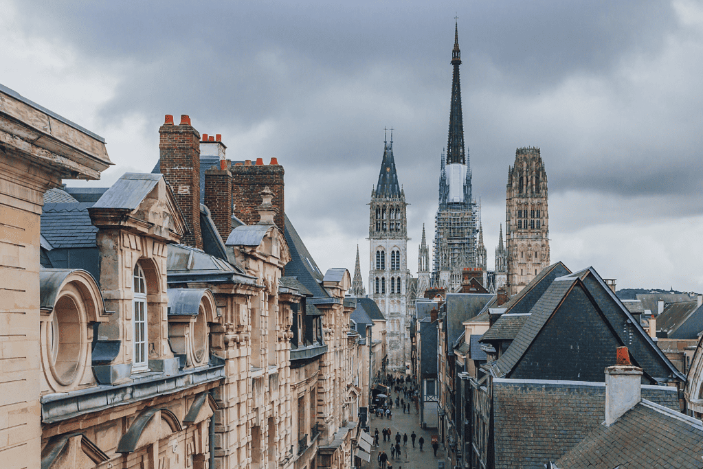 Image of Rouen Cathedral undergoing renovations for a blog post covering the tallest buildings in history