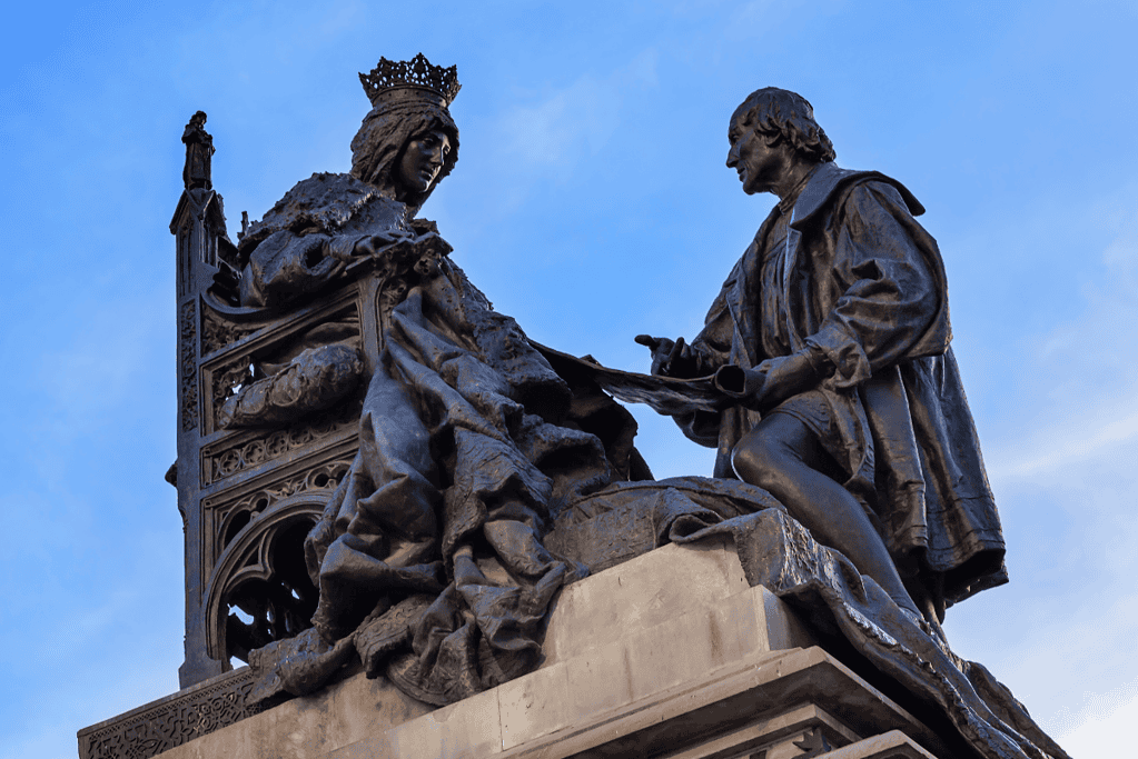 Image of a statue of Queen Isabella of Spain and Christopher Columbus for a blog post providing a list of Spanish Kings and Queens.
