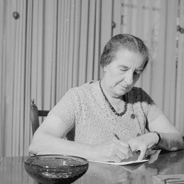 Image of Israeli Prime Minister Golda Meir working at her desk for a blog post covering interesting facts about Golda Meir.