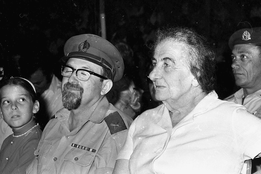 facts-about-golda-meir-reluctant-leader Image of Golda Meir listening to a presentation of some sort off image.