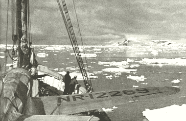Image of a ship navigating ice floes in Antarctica for a blog post covering famous expeditions to antarctica.
