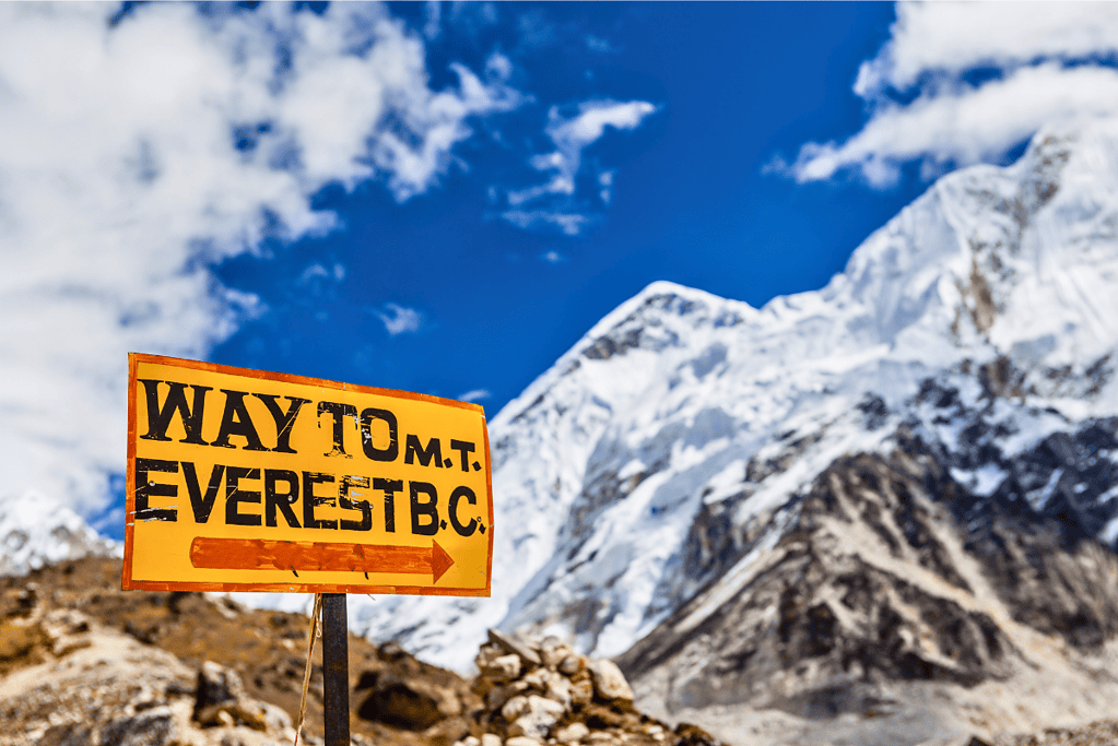 famous-mountain-climbers-sir-edmund-main Image of a sign pointing to the Mount Everest base camp for a blog post covering the world's most famous mountain climbers.