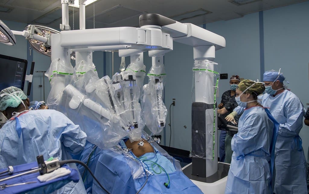 Image of a robotic surgical system's arms operating during a minimally invasive procedure